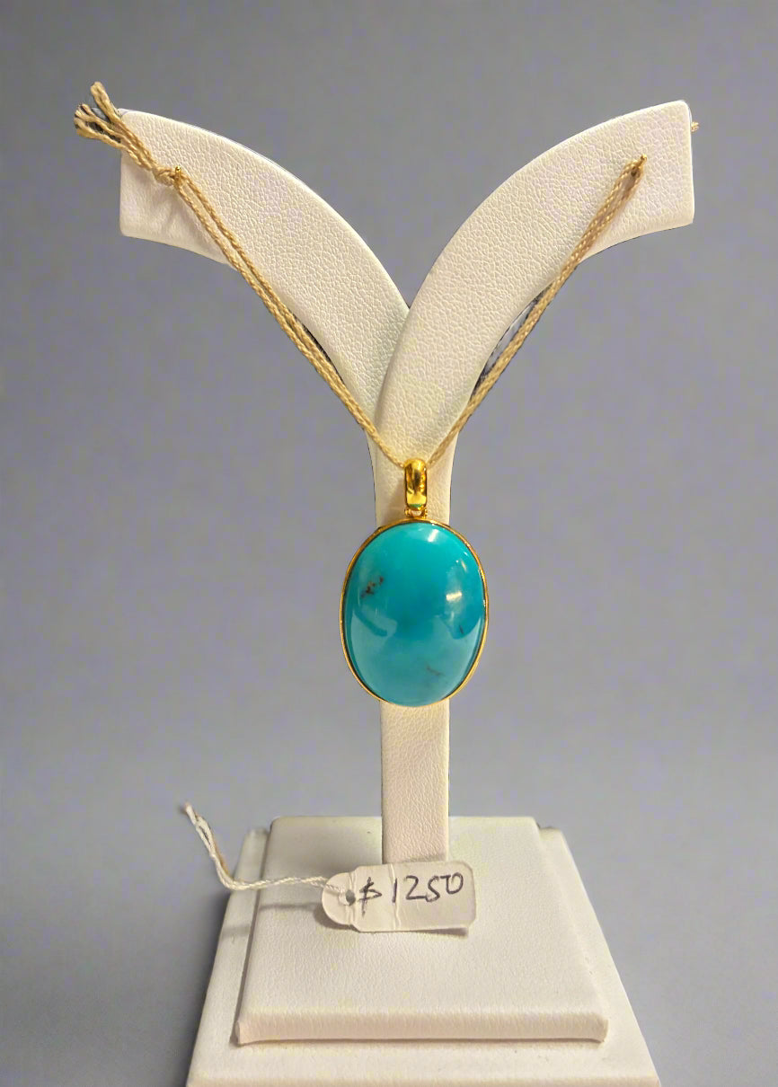 Turquoise with 18k gold pendant.